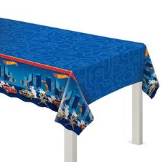 a blue tablecloth with sonic the hedgehogs on it and an image of cityscape