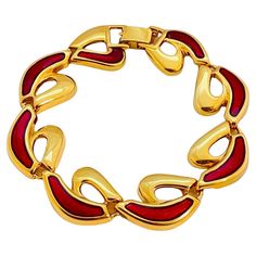 DETAILS unsigned gold tone with red enamel vintage designer runway bracelet MEASUREMENTS 8" by 0.75" CONDITION excellent vintage condition / new old stock ❤️❤️ VINTAGE DESIGNER JEWELRY ❤️❤️ Elegant Red Enamel Bracelets, Bracelet Measurements, Designer Runway, Vintage Designer Jewelry, Gold Link, Enamel Bracelet, Vintage Designer, Designer Jewelry, Chain Link Bracelet