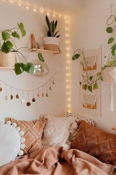 a bedroom with plants and lights on the wall