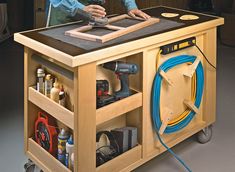 a man working on a workbench with tools