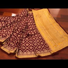 Pure Maroon Georgette Banarasi Saree With Latest Designer Frills On The Saree . Comes With Yellow Unstitched Blouse Piece. Ready To Ship Yellow Silk Sharara With Dupatta, Traditional Yellow Dola Silk Pre-draped Saree, Yellow Silk Sets For Navratri, Yellow Silk Sets With Traditional Drape, Yellow Silk Sets With Dupatta, Yellow Zari Work Art Silk Sharara, Traditional Yellow Chanderi Sharara, Yellow Art Silk Sharara For Navratri, Yellow Silk Sharara For Navratri