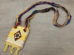 "This one of a kind bohemian necklace is made of a \"kourelou'' piece. \"Kourelou'' is the Greek name for the traditional colorful rug, made from recycled strips of cotton fabrics. The \"kourelou'' pendant is decorated with fine grosgrain fabric, which is hand embroidered with semi-precious jasper and sodalite chip beads and with high quality sari pure silk yarn in an impressive range of colors The lovely materials with different textures, the decorative hand stiches details and the vibrant summ Traditional Rectangular Necklace For Festivals, Traditional Multicolor Rectangular Necklace, Artisan Beaded Necklaces With Boho Collar For Festivals, Bohemian Festival Necklaces, Fair Trade, Bohemian Multicolor Beaded Necklace With Boho Collar, Multicolor Bohemian Beaded Necklace With Boho Collar, Bohemian Handmade Beaded Necklaces For Festivals, Bohemian Fair Trade Festival Necklaces, Bohemian Handwoven Rectangular Jewelry