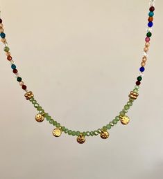 This beautiful multicolor gemstone necklace is a perfect gift for your loved ones; girlfriend, wife, mom, sister, best friend. This delicate, brightly colored necklace is the perfect fashion accessory and would complement any Mediterranean style. It is modern but inspired by antique jewelry. It is handmade with delicate brightly colored glass beads and finished with zamac gold coins made in Greece. Care instructions; Avoid contact with water or chemicals to preserve the gold plating and shine. Dainty Adjustable Chain Jewelry For Festivals, Bohemian Gold Choker With Colorful Beads, Gold Crystal Choker Necklace For Festival, Gold Crystal Choker Necklaces For Festival, Gold Crystal Choker For Festivals, Bohemian Crystal Choker Necklace For Party, Bohemian Charm Necklace With Adjustable Chain For Party, Bohemian Green Choker As Gift, Bohemian Green Choker As A Gift