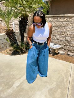 High-waisted chambray, wide leg pants featuring a front top-stitch yoke design and two front pockets. -Lightweight -High rise -Slant front pockets -Darts in the front and back -(S) Rise: 13", Inseam: 30.25" -Model is 5'1" and wearing a size medium - if you are not sure go a size up, like I did. Chambray Pants, Chambray, Wide Leg Pants, Wide Leg, High Waisted, Pants, Blue, How To Wear, Clothes