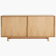 the sideboard is made from wood and has two doors, one door open to reveal a