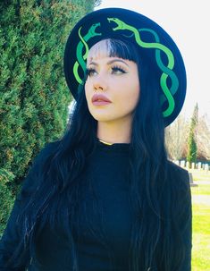 Welcome to Witchwood's brand new hat line! These wide brim hats are made of sturdy vegan felt and are all hand printed.     Vegan Felt Size: 22.5" (but size is adjustable and can be sized down, inside the hat) Brim - 2.5" wide Hat Color - Black Print Color - Green & Light Green   Hats will ship in 7-10 business days from date of order Adjustable Brimmed Felt Hat For Halloween, Fitted Brimmed Halloween Hat, Fitted Brimmed Hat For Halloween, Wide Brim Hats For Costume Party, Black Fedora Felt Hat For Halloween, Halloween Adjustable Short Brim Felt Hat, Adjustable Short Brim Felt Hat For Halloween, Adjustable Brimmed Felt Hat For Costume Party, Fitted Fedora Halloween Costume Hat