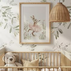 a baby's room decorated with wallpaper and a bunny in a pink tutu