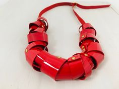 The love is red, this necklace is red, you will be in love with this necklace. Made of red patent leather, this gorgeous necklace will transform a simple outfit in a modern bold statement. Although it looks so chunky is a very lightweight piece . You can adjust the length to get differents options. Adjustable length from 32 to 20 inches. You can choose 3 differents patent leather colors, Red, Black and white IMPORTANT INFORMATION Process time -2-5 business days For further information about the Chic Red Necklace For Party, Modern Red Necklace For Party, African Earrings, Handmade Inspiration, Bold Necklace, Leather Colors, Golden Necklace, Red Necklace, Necklace Red