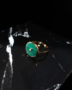 round shape malachite ring featuring white zircon stone in the centre yellow gold vermeil with electro-coating malachite size approx. 11mm x 11mm white zircon stone size approx. 1.3mm x 1.3mm setting size approx. 12.1mm x 12.1mm band width 1.4mm total weight approx. 1.98g size 6 with adjustable band Please Note: Each ring may look different from the photos showing, due to the natural pattern of malachite stone.helpful tips:In order to keep the gold vermeil jewelry always shining, try to keep it away from water, alcohol, perfume and chemicals; remove during physical activities; store separately in a soft pouch.When adjusting the ring band, gently pull/push both sides of the band with both hands, avoiding harsh movement. Malachite Ring, Malachite Rings, Always Shine, Gold Vermeil Jewelry, Malachite Stone, Vermeil Jewelry, Patterns In Nature, Ring Band, Helpful Tips