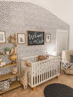 a baby's room decorated in black and white