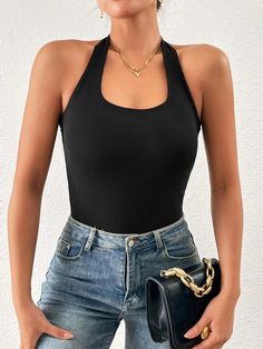 Stroll down the street in style in our Solid Backless Halter Neck Ribbed Bodysuit. This sleeveless stunner is perfect for any occasion, whether you're hitting the town with your friends or spending a night out with your significant other. The slim-fit design hugs your curves in all the right places, while the backless halter neck adds a touch of playfulness. And in classic black, you'll always be on-trend. The ribbed texture adds an extra layer of sophistication, making this bodysuit a must-have for any fashion-forward wardrobe. Features: Color: Black Style: Casual Neckline: Halter Details: Backless, Rib-Knit Sleeve Length: Sleeveless Fit Type: Slim Fit Fabric: Slight Stretch Composition: 92% Viscose, 8% Spandex Care Instructions: Machine wash or professional dry clean Belt: No Sheer: No P Halter Neck Bodysuit, Ribbed Knit Bodysuit, Ribbed Bodysuit, Knit Sleeve, Style Noir, Halter Neck, Classic Black, Rib Knit, Ribbed Knit