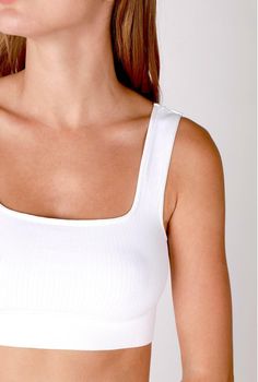 Feel comfy and adorbs in the NIKIBIKI White Cropped Ribbed Tank! Made of stretchy ribbed knit, this cropped tank has a square neckline, wide straps, a fitted sleeveless bodice, and a cropped hem. Perfect with high-waisted leggings or your fave ripped shorts! DETAILS & FIT Fitted. 92% Nylon, 8% Spandex. Machine Wash Cold. Made in the USA. One size fits XS-XL. Statement Crop Top, Tiny Crop Top, Custom Crop Top, Hoodie Customize, Tailgate Outfit, Maxi Jumpsuit, Athleisure Tops, Color Text, Silk Bottoms