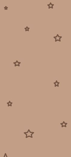 a brown wall with stars on it