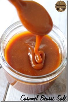 caramel sauce being poured into a glass jar