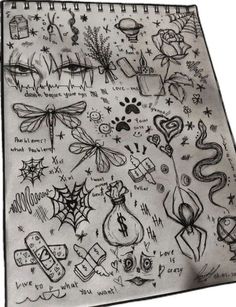 a drawing of various items on a white sheet with black writing and symbols around it