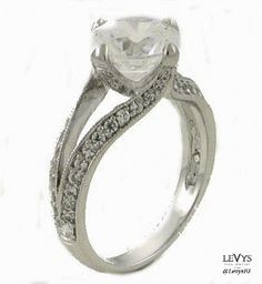 an engagement ring with a white diamond in the center