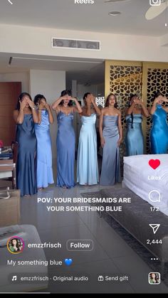 a group of women standing next to each other in front of a bed with their hands on their head