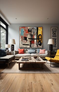 a living room filled with furniture and a painting on the wall above it's coffee table