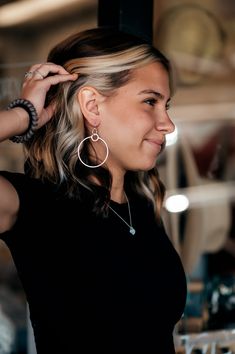 Add a touch of fun and flirtiness to your everyday look with our Zoe Brushed Hanging Hoop Earrings. These unique earrings feature a large hoop hanging from a smaller one, which gives it fun movement. They are perfect for adding a playful touch to any outfit! All of our jewelry is nickel free so you don't have to worry about that horrible nickel allergy! These brushed gold or silver earring pendants hang on 14k gold-filled or sterling hooks. Metal Open Circle Hoop Earrings, Trendy Nickel-free Hoop Earrings For Party, Adjustable Trendy Hoop Earrings, Trendy Adjustable Dangle Hoop Earrings, Nickel Allergy, Cut Clothes, Flat Heel Boots, Diff Eyewear, Thermal Sweater