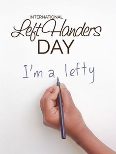 a hand writing on a piece of paper with the words international left - handeders day i'm a lefty