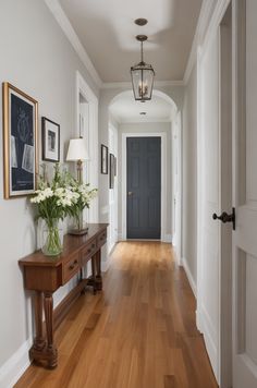 the hallway is clean and ready for us to use as an entrance way in this home