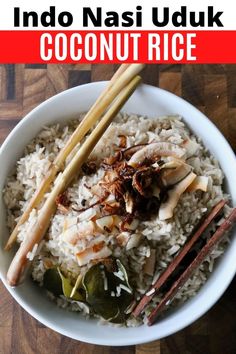 an image of coconut rice with chopsticks in it on a wooden table text reads indo nasi uduk coconut rice