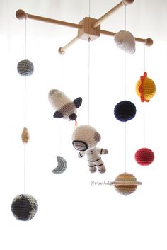 a crocheted mobile is hanging from the ceiling