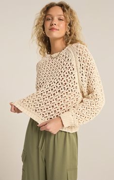 This sweater is a modern take on classic knitwear, featuring raglan sleeves and a sophisticated semi-sheer openwork knit pattern. Crafted from midweight sweater yarns, it boasts full-length blouson sleeves that provide both style and comfort, making it a versatile addition to any wardrobe. Sweater Yarns: 62% Polyester 38% Cotton Crew neck Long sleeve Midweight Heavy soft wash Hand Wash Cold, Turn Inside Out, Reshape and Lay Flat to dry Fits True to Size Classic Knitwear, Indah Clothing, Denim Sweater Jacket, Fawn Design, Sparkle Shoes, Loungewear Luxury, Denim Sweater, Jumpsuit Jacket, Taurus And Gemini