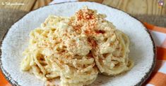 a white plate topped with macaroni and cheese