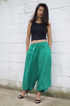 M E A S U R E M E N T S Waist 26 in. up to 40 in. (max with elastic band) Hips up to 54 in. Wide leg circumference 30 in. Inseam 23 in. Pocket 2 pockets Total length 35 in. Material High quality linen fabric M O D E L * Size US4 * Height 5 ft. 4 in. or 163 cm. With or without 4 in. high heels. These pants are a new addition to our linen pants collection. They're made with high quality linen with high end detailing and are tailored to make you look and feel your best! The pants are very roomy wit Summer Green Parachute Pants With Loosely Fitted Hips, Baggy Green Parachute Pants For Summer, Relaxed Fit Harem Bottoms For Summer, Green Relaxed Fit Parachute Pants For Summer, Green Summer Harem Pants With Pockets, Green Harem Pants For Spring, Summer Harem Bottoms With Pockets, Harem Bottoms With Pockets For Summer, Green Harem Pants For Yoga In Summer