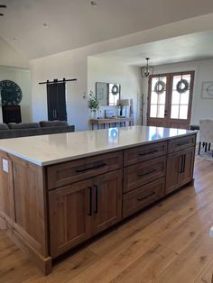 a large kitchen island sitting in the middle of a living room