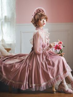 This Pink Lolita Long Lace Tea Length Dress is the perfect choice for any Edwardian-inspired event. The delicate lace fabric is finished with a beautiful scoop neckline and long sleeves. The unique tea length skirt is highlighted by the intricate lace detailing. The soft pink hue adds a romantic and feminine touch to the dress. The comfortable fit ensures that you look and feel your best in this beautiful Edwardian-style dress. The timeless design of this dress makes it a timeless piece that you Princess Style Lace Dresses With Lace Trim, Elegant Lace Patchwork Dress For Costume Party, Pink Lace Trim Dress For Costume Party, Vintage Lace Trim Dress For Tea Party, Elegant Pink Dress For Tea Party, Pink Lace Dress With Contrast Lace, Feminine Lace Trim Dress For Tea Party, Feminine Victorian Lace Dress With Lace Trim, Pink Lace Tea-length Dress