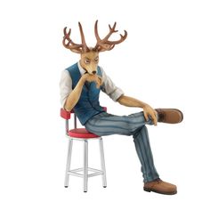 a man sitting on top of a red chair next to a deer head statue in front of a white background