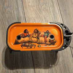 an orange tray with some pictures on it