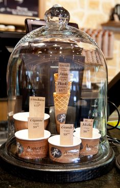 an ice cream display under a glass dome