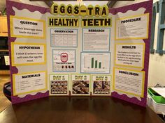 an egg - stra healthy teeth poster is displayed in front of a wooden table