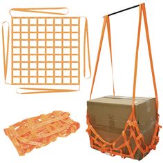 an orange safety net and some boxes on a white background with one box in the foreground