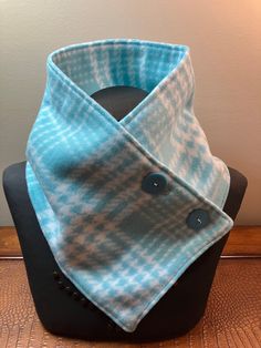 Hand sewn with love is this warm & comfortable aquamarine green plaid neck warmer scarf with two buttons that will keep you warm during the cold winter months.   This  scarf can be worn under a coat to go out in or as a decorative accessory to your daily work attire.   Neck warmers make a great alternative to a bulky scarf.   Each neck warmer scarf is individually handmade with close attention to detail and I select only high quality fabrics that will work for the item I am making. I work in a s Poncho Pattern Sewing, Bulky Scarf, Fleece Projects, Neck Warmers, Scarf Tutorial, Fleece Scarf, Scarf Neck, Poncho Pattern, Pattern Sewing