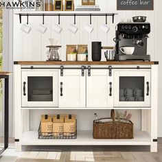 a coffee bar with white cabinets and shelves filled with cups, mugs and other items