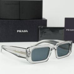 Brand New Prada Pr06ys 12r09t Transparent Grey Dark Grey Rectangle Unisex Sunglasses Pr 06ys 100% Authentic & Brand New! Same/Next Day Free Shipping! No Offers Accepted. Final Price! Don't Miss Out, Shop Now! Brand: Prada Model Number: Pr06ys / Pr 06ys Color Code: 12r09t Gender: Unisex Frame Shape: Rectangle Frame Color: Transparent Grey Frame Material: Acetate Frame Type: Full Rim Lens Color: Dark Grey Uv Protection: Category 3 Lens Material: Polyamide Size: 53x21x145 100% Uv Protection Made In Luxury Clear Rectangular Sunglasses, Designer Clear Sunglasses For Party, Designer Clear Glass Sunglasses, Designer Rectangular Glass Sunglasses, Prada Model, Sunglasses Women Designer, Grey Sunglasses, Grey Frame, Black Cat Eyes