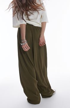 Go for chic volume in these roomy pants cut from gorgeous plissé fabric for textural intrigue. 28" inseam; 20" leg opening; 16" front rise; 19" back rise (size Medium) Elastic waist 100% polyester Machine wash, line dry Made in Turkey Plisse Fabric, Dark Khaki, Pull On Pants, Khaki Green, Leg Pants, Elastic Waist, Topshop, Balloons, Nordstrom