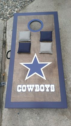 a bean bag toss game with cowboys on it