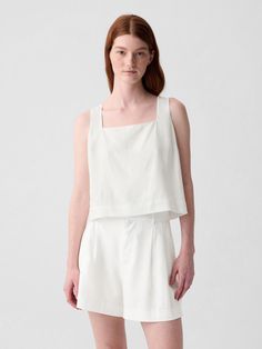 Soft linen-blend cropped shell tank top.  Square neck.  Tank straps.  Buttons at back.  * Fit: Slightly fitted.  Sits close to the body.  Cropped, hits at the waist.  Models wearing Gap Fitted Cropped Top By Gap, Fitted Linen Tank Top For Everyday, Chic Sleeveless Gap Tops, Chic Sleeveless Tops By Gap, Gap Cropped Tops For Spring, Chic Fitted Linen Tank Top, Fitted Slightly Cropped Tank Top For Summer, Chic Cropped Tank Top For Everyday, Fitted Crop Top With Cropped Hem For Summer