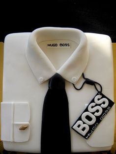 a white shirt with a black tie and a tag on the collar that says boss