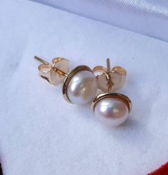 **FREE EXPRESS SHIPPING** A beautiful white pearls in gold stud earrings A delicate studs for the bride Or a special gift for you Can be ordered with different pearl color Earring Size: 7.5 mm Pearl size: 6 mm The earrings is from 14k gold solid The earrings is custom made especially for you Please give us 3-5 working days to make, pack and send it to you Handmade Yellow Gold Pearl Earrings For Wedding, Fine Jewelry Yellow Gold Pearl Earrings For Wedding, Hallmarked White Gold Pearl Earrings For Wedding, Wedding Hallmarked White Gold Pearl Earrings, White Pearl Earrings For Wedding Fine Jewelry, Handmade Classic Yellow Gold Pearl Earrings, Classic Handmade Pearl Earrings For Formal Occasions, Classic Handmade Yellow Gold Pearl Earrings, Classic Bridal Earrings In 14k White Gold