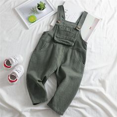 Girls Pocket Corduroy Solid Jumpsuits - PrettyKid Solid Cotton Overalls, Khaki Cotton Jumpsuits And Rompers For Fall, Solid Cotton Jumpsuits And Rompers With Pockets, Cotton Jumpsuits And Rompers With Pockets, Green Fall Overalls With Pockets, Khaki Cotton Long Sleeve Jumpsuits And Rompers, Khaki Overalls For Fall, Fitted Cotton Overalls In Solid Color, Khaki Fall Overalls