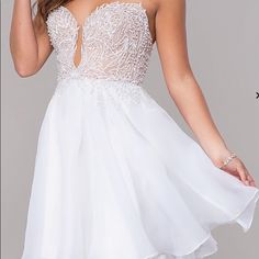 Embroidered-Bodice Short Strapless Homecoming Dress Details Closure: Back Zipper, Hook And Eye Details: Embroidery, Pearl Beads, Illusion, Rolled Hem, Bra Cups Fabric: Self: 100% Polyester, Organza Lining: 100% Polyester, Satin Fit: The Model Is 5'9.5". Length: Dress 29" Hollow To Hem 32" Neckline: Strapless Sweetheart Waistline: Natural Never Worn. Brand New With Tags. Retails For $140 White Strapless Dress With Sweetheart Neckline For Homecoming, White V-neck Homecoming Dress, White Embroidered Mini Dress For Party, White Embellished Dress With Sweetheart Neckline, White Mini Dress With Lace Bodice And Sweetheart Neckline, White Embellished Mini Dress For Prom, Elegant Embroidered Dress For Homecoming, Elegant Embroidered Homecoming Dress, White Embellished Embroidered Party Dress