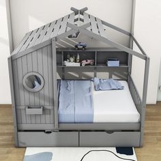 a child's bed with a built - in bunk and storage space underneath it