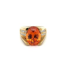 GIA Certified Unisex Ring in 18K Yellow Gold, weighing 14.90 grams, boasting a 13.5 carat oval cut Spessartine Garnet center stone. The vibrant orange gem is superbly clean and lustrous. Exploding with color and brilliance. Adorned with 16 princess cut diamond side stones, totaling 0.96 carats.  This Spessartine Garnet is extremely rare due to its rich Mandarine Orange color, lack of inclusions, and 13.5 carat size.   Item Details: - Type: Unisex Ring  - Metal: 18K Yellow Gold  - Weight: 14.90 Grams  - Setting: 4-Prong  - Size: 7.5 (adjustable) - Mounting: 17 MM elevation  ___________________________  Center Stone Details: - Type: Spessartine Garnet  - Carat: 13.5  - Cut: Oval-Brilliant - Color: Mandarine Orange  - Measurements: 14.24 x 10.75 x 8.08 MM   GIA Certificate #: 6234022072  GIA Orange Oval Rings With Accent Stones, Orange Rings With Center Stone For Formal Occasions, Formal Orange Rings With Accent Stones, Oval Orange Ring With Center Stone, Formal Orange Rings With Center Stone, Formal Orange Oval Rings, Formal Orange Ring With Center Stone, Oval Orange Rings With Accent Stones, Modern Orange Oval Rings