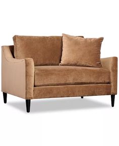 a brown couch with two pillows on it